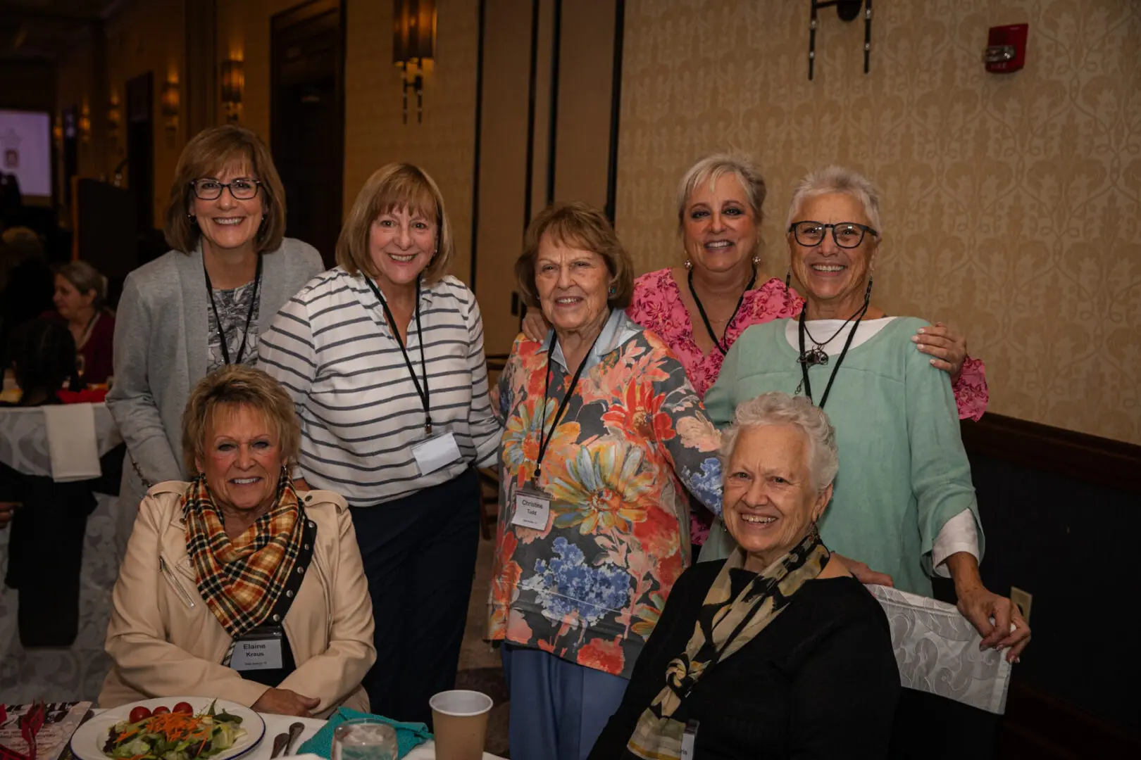 Group of smiling women at a conference.