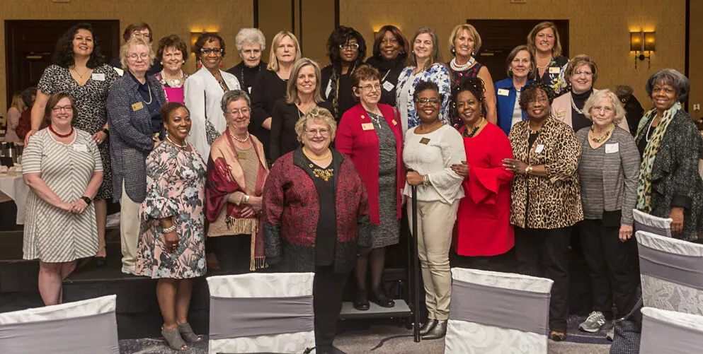 Group of women posing at an event.