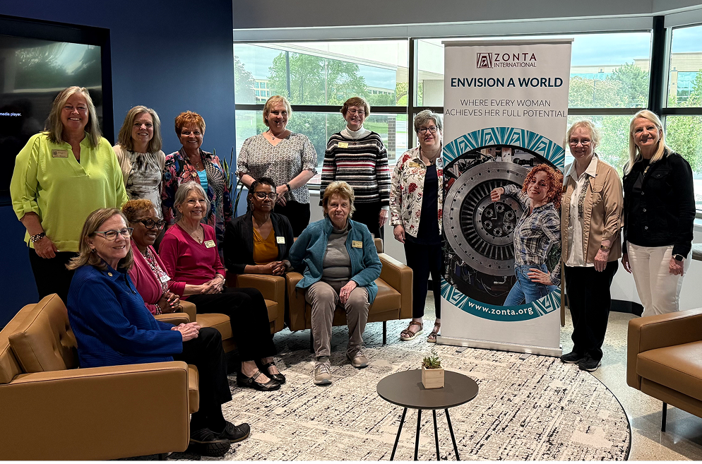 Group of people gathered indoors for a presentation or meeting.